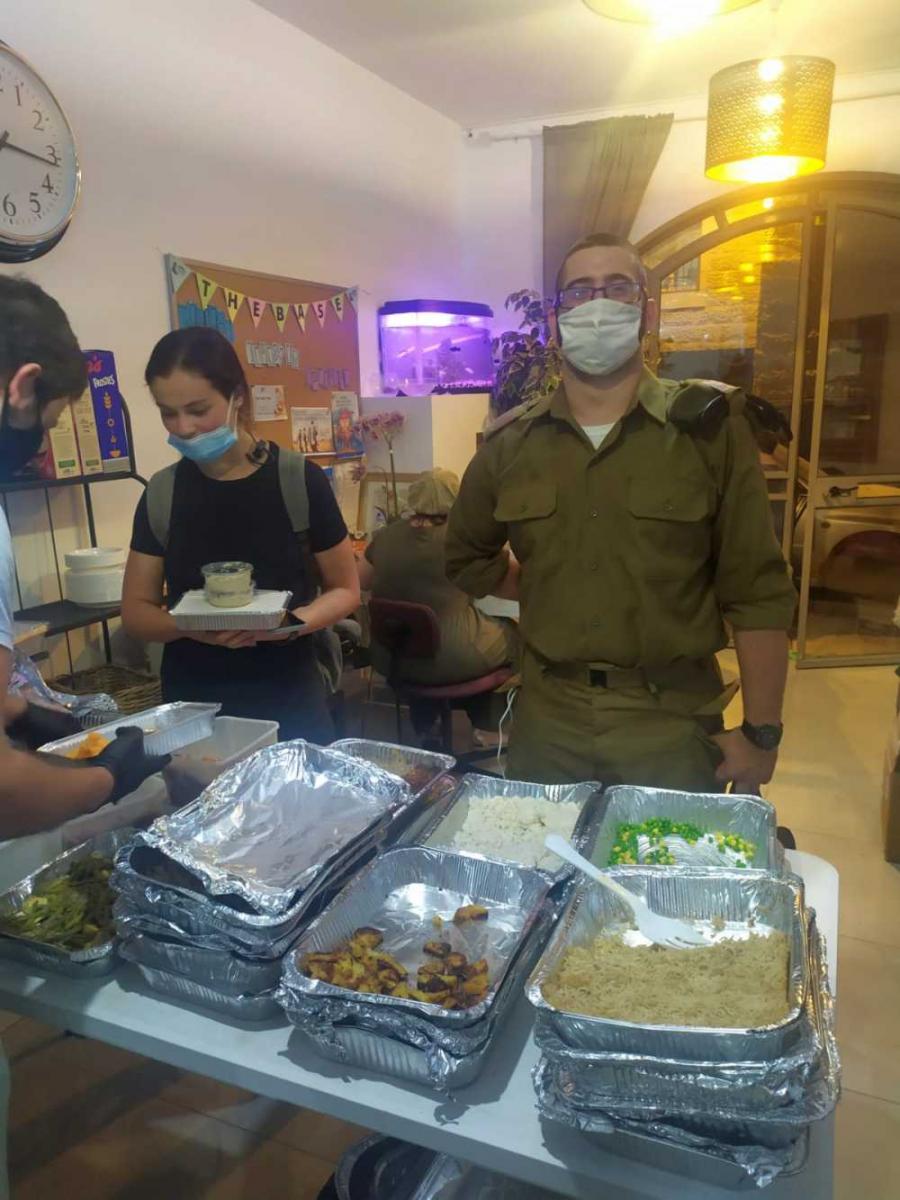 Serving meals at the Michael Levin Base to lone soldiers. 